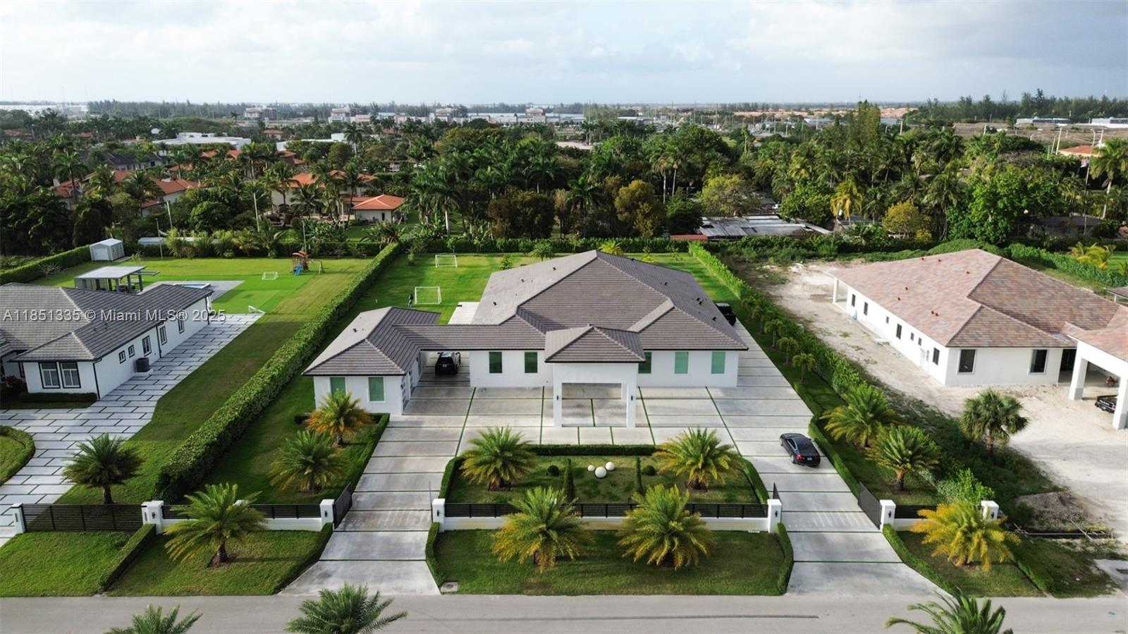 Welcome to your private oasis in Hialeah Gardens! This newly constructed 6-bedroom, 6-bath estate spans over 7,800 sq ft on a 1.14-acre lot. Featuring volume ceilings, a chef’s kitchen with stainless steel appliances and a large island, spacious in-law quarters, and elegant ceramic tile flooring throughout. Enjoy resort-style living with a heated saltwater pool, mature fruit trees, and expansive outdoor entertaining areas. High-impact windows and doors, RV access, and a 2-car garage complete this luxurious retreat. No HOA. Zoned for residential and agricultural use. A rare opportunity to own a custom-built masterpiece!