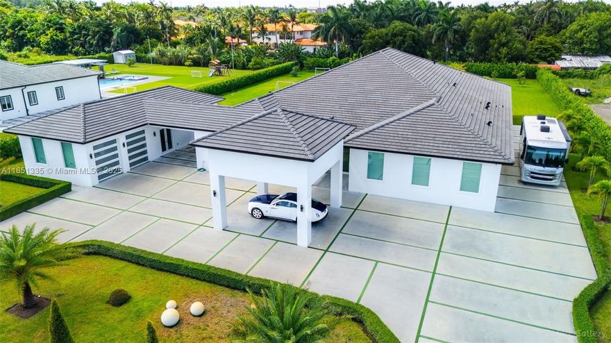 Welcome to your private oasis in Hialeah Gardens! This newly constructed 6-bedroom, 6-bath estate spans over 7,800 sq ft on a 1.14-acre lot. Featuring volume ceilings, a chef’s kitchen with stainless steel appliances and a large island, spacious in-law quarters, and elegant ceramic tile flooring throughout. Enjoy resort-style living with a heated saltwater pool, mature fruit trees, and expansive outdoor entertaining areas. High-impact windows and doors, RV access, and a 2-car garage complete this luxurious retreat. No HOA. Zoned for residential and agricultural use. A rare opportunity to own a custom-built masterpiece!