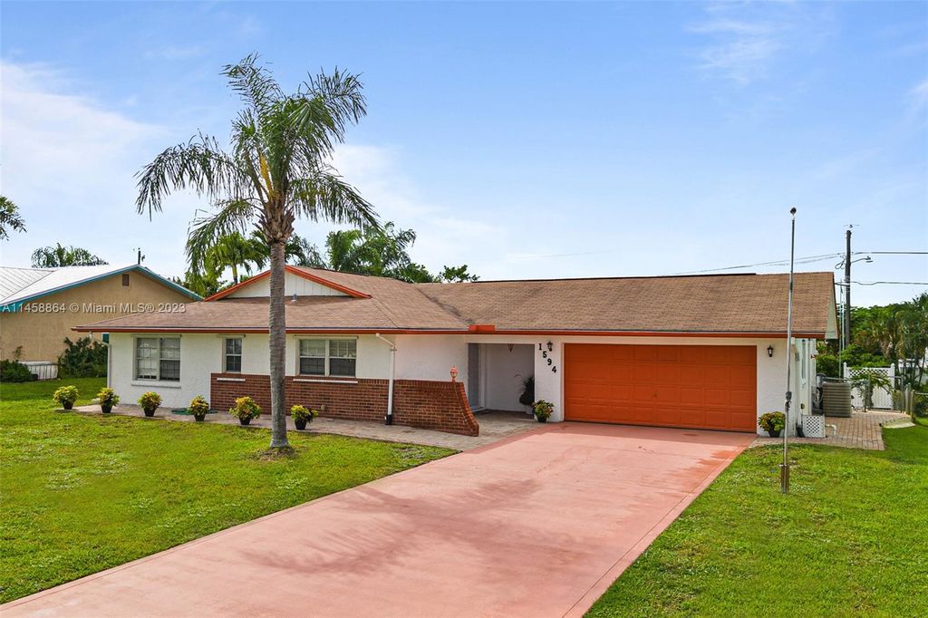 Photo of 1594 NE 24th St, Jensen Beach, FL 34957 (MLS # A11458864)