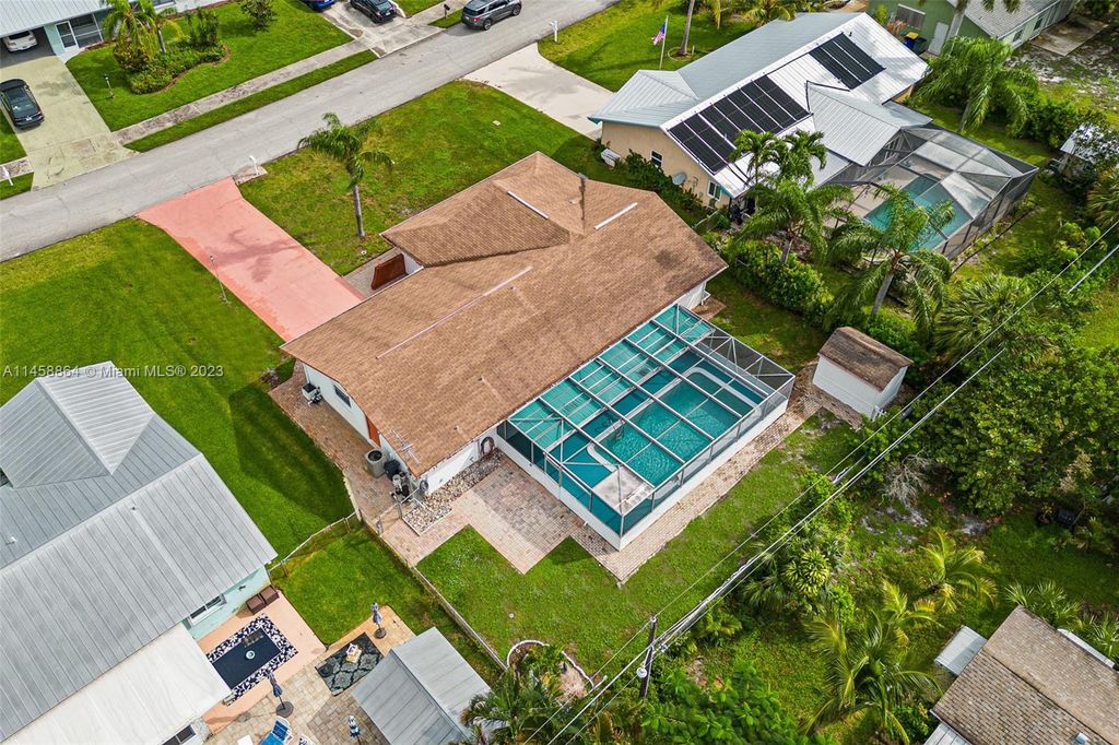 Photo of 1594 NE 24th St, Jensen Beach, FL 34957 (MLS # A11458864)