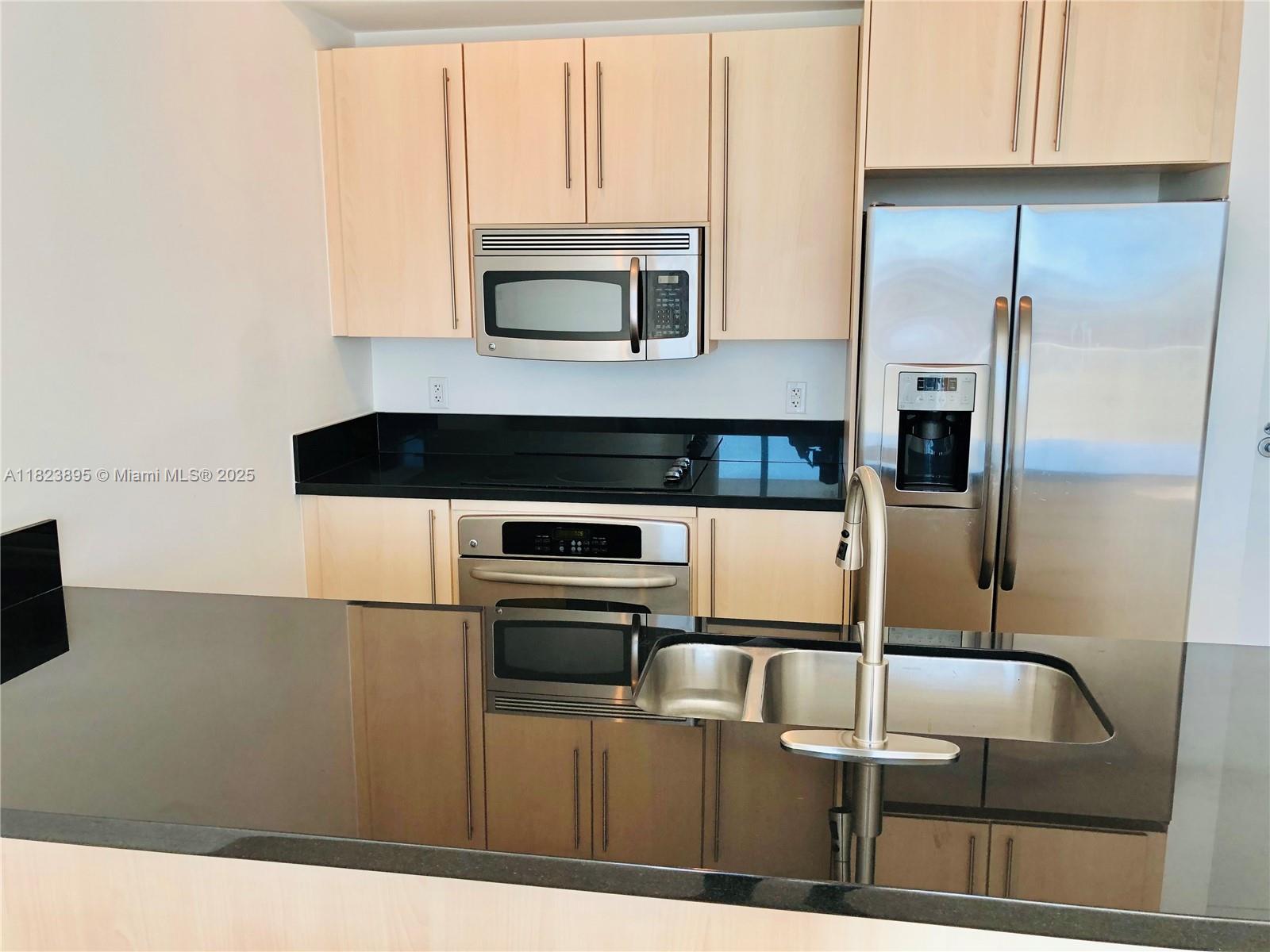 Bright & Spacious 1/1 at Axis on Brickell, Southern exposure with nice lawn and pool views. Open kitchen with stainless steel appliances. New porcelain Tile. Washer & Dryer inside unit. 1 Parking space assigned inside garage.