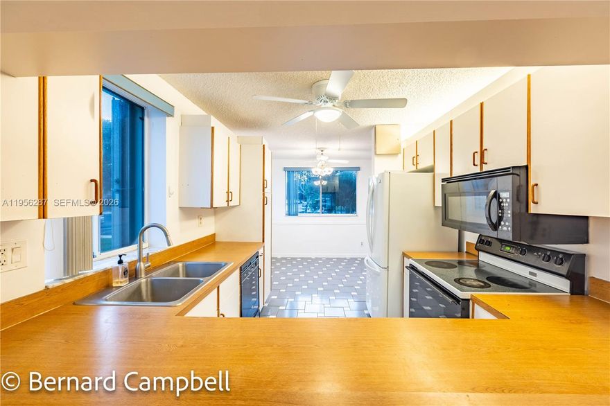 1st FLOOR CORNER UNIT in a newer building. Welcome to the Devon Section of the prestigious Kings Point gated community. This beautifully maintained 2-bedroom, 2-bath CORNER condo is filled with natural light and offers stunning water views from both the living room and the primary bedroom. Spanning 1,294 square feet, the home features an efficient and spacious layout with a generous kitchen, combination dining area, and comfortable family room—perfect for everyday living and entertaining. Enjoy walk-in closets, an eat-in kitchen, and pride of ownership evident from the immaculate exterior to the thoughtfully cared-for interior. Condo has a newer AC and water heater. Kings Point offers resort-style amenities including multiple pools, a fully equipped gym, billiards room, library, and an active community center. Water and cable are included, adding exceptional value and convenience. Association represents a 55+ community. This exceptional opportunity won’t last—schedule your showing today.