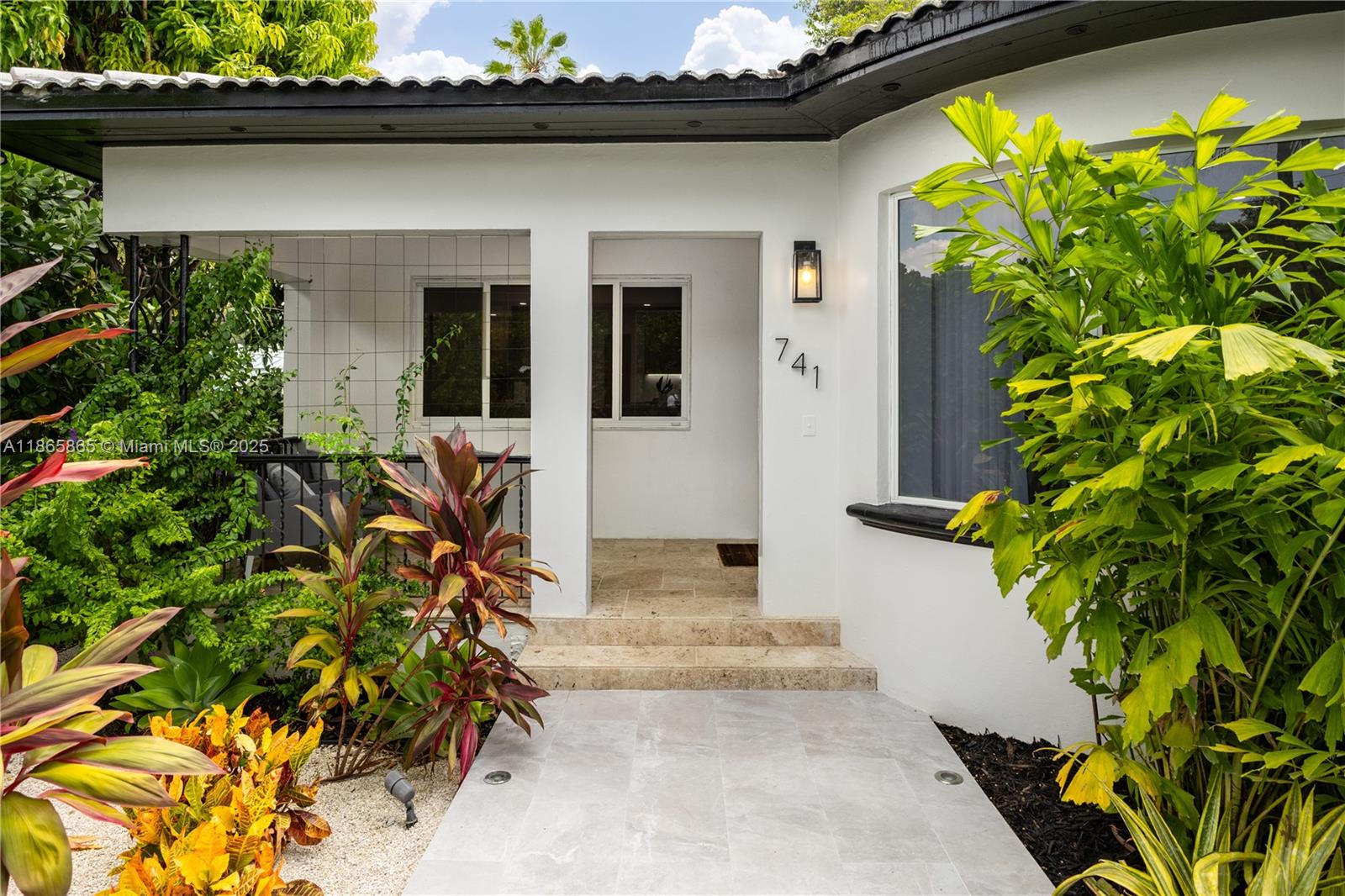Beautifully renovated Mid-Century 3BR/2BA bungalow blends timeless charm with modern luxury. Light-filled open layout features a gourmet kitchen with terrazzo counters, new cabinets/appliances, custom closets, motorized Somfy shades, 86” LG & Samsung Frame TV, plus updated plumbing & electrical. Outdoors, enjoy a heated pool with sun deck, Traeger smoker, Nexgrill BBQ, bistro area & professional landscaping with pathway lighting. Secure gated entry with motorized gate, DoorBird access, Ring cameras, smart A/C, Lutron lighting & EV charging. Spacious driveway for 5 cars. Option to purchase fully furnished. Steps from Biscayne Bay parks, top schools, dining & shopping, this home offers style, comfort & convenience.