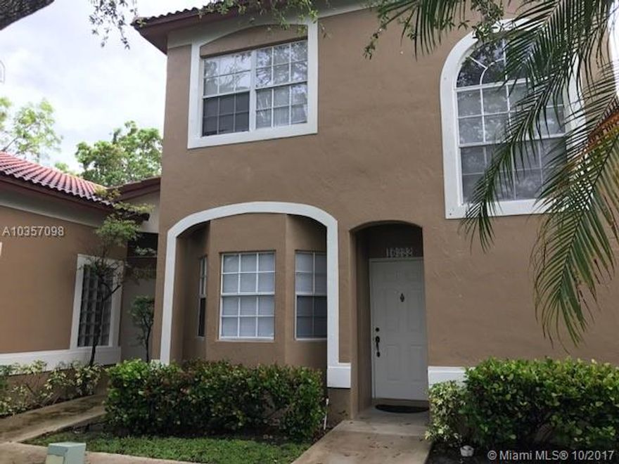 Spacious Weston villa in gated community.  24 hour security guard, community pool and gym.  This super clean corner home has a large living room with high ceilings, large kitchen with pantry and backyard with small patio area.  Master is roomy with walk in closet and bathroom with dual sinks.  Second bedroom has full bath with tub.  Private Storage room for bicycles and other equipment.  Centrally located by I-75.  Won't last.  Call today.