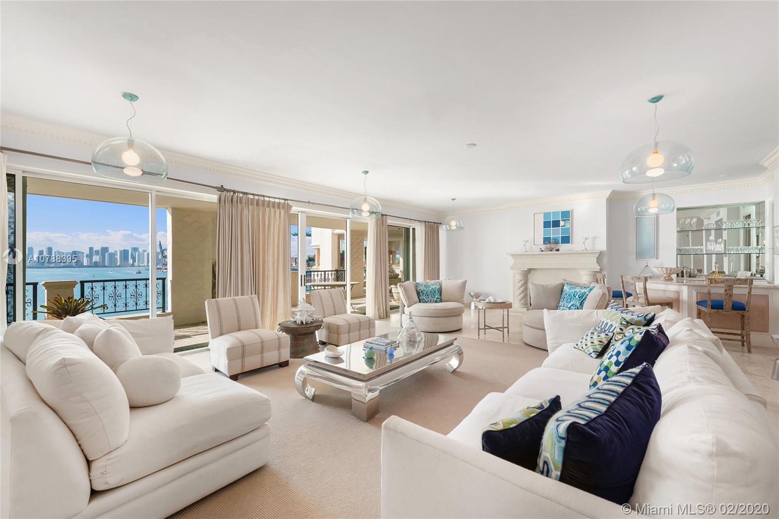 This beautiful Bayview unit on Fisher Island features 5,790 SQFT of interior space & 2 large private terraces w/unobstructed views over Fisher Island, Government Cut, the Atlantic Ocean, Biscayne Bay and the downtown Miami skyline. The spacious open living room and private dining room each have beautiful fireplaces & amazing views to the bay & Miami skyline. A large open kitchen sports top appliances, center Island with eat-in seating, butler&#x2019;s pantry & an adjacent family/media room made to relax & entertain. The principal bayside suite has a fireplace & large bathroom with glass marble shower, sunken spa tub & voluminous walk-in closets. The other 4 bedrooms are well proportioned. 5-star Fisher Island amenities complete this offering.