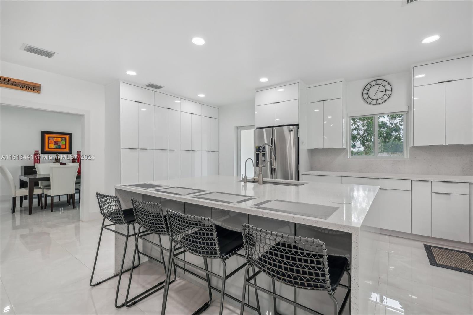Discover this stunning 1.6-acre Redland estate with exceptional rental income potential! There are three separate dwellings. The fully renovated 3 bedroom, 2.5 bathroom house features impact windows, a new roof, AC, and a soaking tub and over 2,900 sq ft of living space. The 2 bedrooms, 2 bathroom in-laws house with a full kitchen and the efficiency unit attached to the massive garage offers up to 5 bedrooms, a kitchen, and a bathroom. Making this property perfect for generating significant rental income. The oversized garage can store boats, an RV, and includes a vehicle lift. The lush property, adorned with mango, lychee, and avocado trees, is a tropical paradise. Combining luxury living with substantial income opportunities, this estate is a rare find. Schedule your showing today!