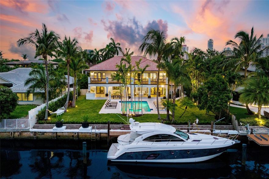 Soak in the sun poolside in your spacious waterfront backyard in the highly sought after gated community of Golden Isles. Fully renovated with an open kitchen, 5 bedrooms, 4.5 bathrooms, built-in summer kitchen, covered terrace, and private dockage for large vessels, this home is a boater's paradise. Centrally located between Miami and Fort Lauderdale on 85 feet of water frontage with no fixed bridges and direct ocean access, you will be able to take full advantage of all that South Florida has to offer.