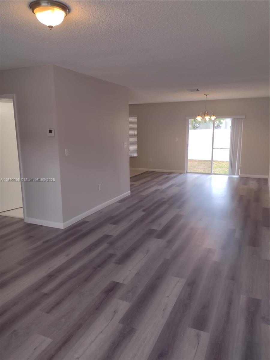 Large 3/2.5 freshly painted townhome with an extra room (den/family room/office), fenced backyard, and a full-size washer and dryer. Brand new laminate flooring throughout the home, large kitchen with newer appliances and high-efficiency A/C. High ceilings in all bedrooms and a walk-in closet in the primary bedroom. 2 parking spaces right in front, fenced yard in the back. Located in a gated, maintained community with a community pool. **EZ Show - Click Show Assist**