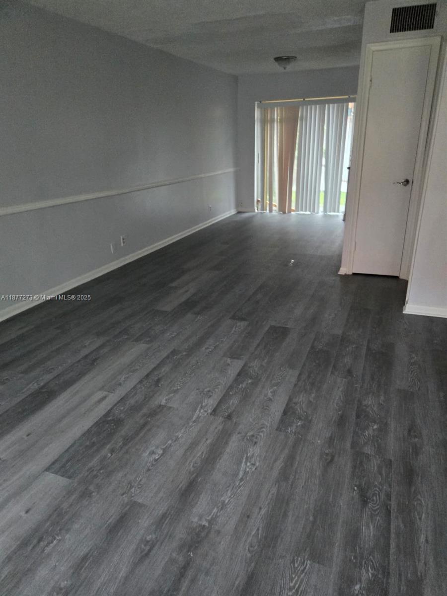 Step into this very nicely upgraded 2-bedroom, 1.5-bath condo with gray wood laminate floors throughout, a modern upgraded kitchen with sleek cabinets, and fresh paint that makes it feel brand new! Offering 940 sq ft of stylish living space, and perfectly located minutes from highways, top-rated schools, and beautiful beaches — this one won’t last! ????