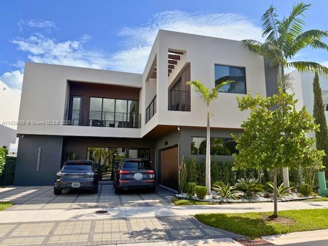 Discover unparalleled luxury in this 2018-built estate. Spanning 3,690 sqft, find five opulent bedrooms, five spa-inspired baths, and high ceilings. Two living rooms complement an expansive kitchen. Outside, a private saltwater pool and outdoor kitchenette with a built-in grill await. Includes a two-car garage plus three additional parking spaces. This property comes with plenty of upgrades including a salt water pool, upgraded built-in kitchen stove ,oven and microwave, external kitchenette by the pool with built in barbecue and fridge, upgraded washer dryer (gas dryer), heavy duty shelves for the master bedroom closets, hardwood flooring for stairs and bedrooms and plenty more! This is a rare opportunity for refined living in a prestigious South Florida enclave.