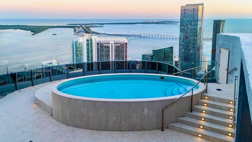 Experience the pinnacle of ultra-luxury living in this designer-ready tri-level skyhome.  Trophy penthouse w/private elevator offers an unparalleled opportunity to craft your dream residence. Boasting an impressive 7,800 SF +/- plus 2,700SF outdoor area in the heart of Brickell Ave/“Financial District” w/endless, unobstructed Bay & city views from every angle. Grand living room feat. triple-height ceilings, floor-to-ceiling glass walls offering a front-row seat to Miami’s breathtaking skyline. An ultra-private rooftop pool awaits ready for your bespoke summer kitchen, outdoor shower and wet bar. Ample entertaining spaces offer breathtaking panoramas of the surrounding architecture and stunning sunrises and sunsets.