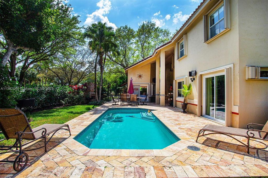 Photo of 5701 NW 60th Pl, Parkland, FL 33067 (MLS # A11352040)