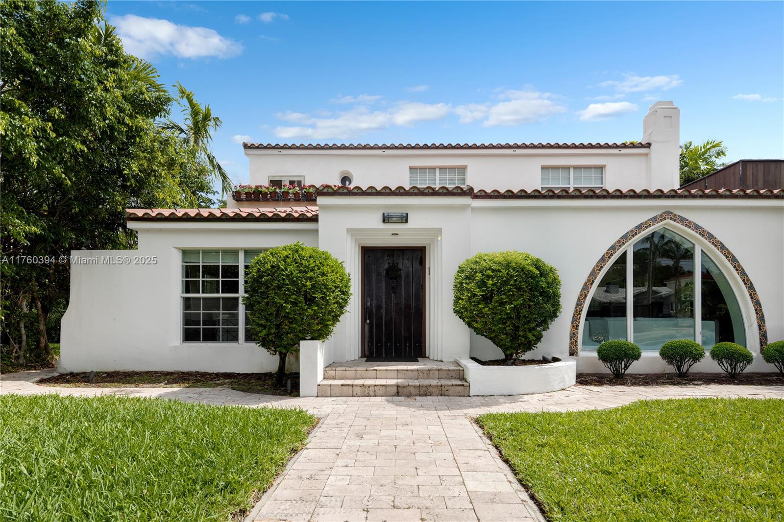 Discover this Spanish Mediterranean home, designed by the renowned architect, Albert Anis. This architectural beauty is situated on an oversized 10,125 SF lot, offering electric gates, ample parking & a private resort-style backyard w/ a covered patio, pool, spa & 1/1 guest house. Inside the main house, find 4 BD, 3 BA, warm sun-filled w/, high ceilings, a gorgeous open eat-in gas kitchen, a separate laundry room & impact windows/doors. The main level includes 2 bedrooms w/ en-suite baths. Upstairs, there are 2 additional bedrooms w/ 1 bath, easily convertible into a massive primary suite. The primary features a sunroom & balcony, while the other upstairs bedroom has a porch w/ a staircase for an additional exit. Restoration Hardware light fixtures excluded.