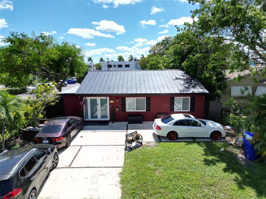 Charming 3-Bedroom, 2-Bath Home Near Hollywood Circle Located in Downtown Hollywood's Cultural Center, this spacious home features an open layout, tiled floors, and charming archways. With NEW impact windows, NEW ROOF 2025, NEW A/C 2025 and updated floors, it's move-in ready! The property includes separate in-law quarters with a private entrance, perfect for a large family or as an income property. Enjoy walking to restaurants, cafés, and shops, with beaches just minutes away. Offering multiple zoning opportunities, this home is ideal for both living and investment. Don’t miss out on this A+ location—schedule your showing today!