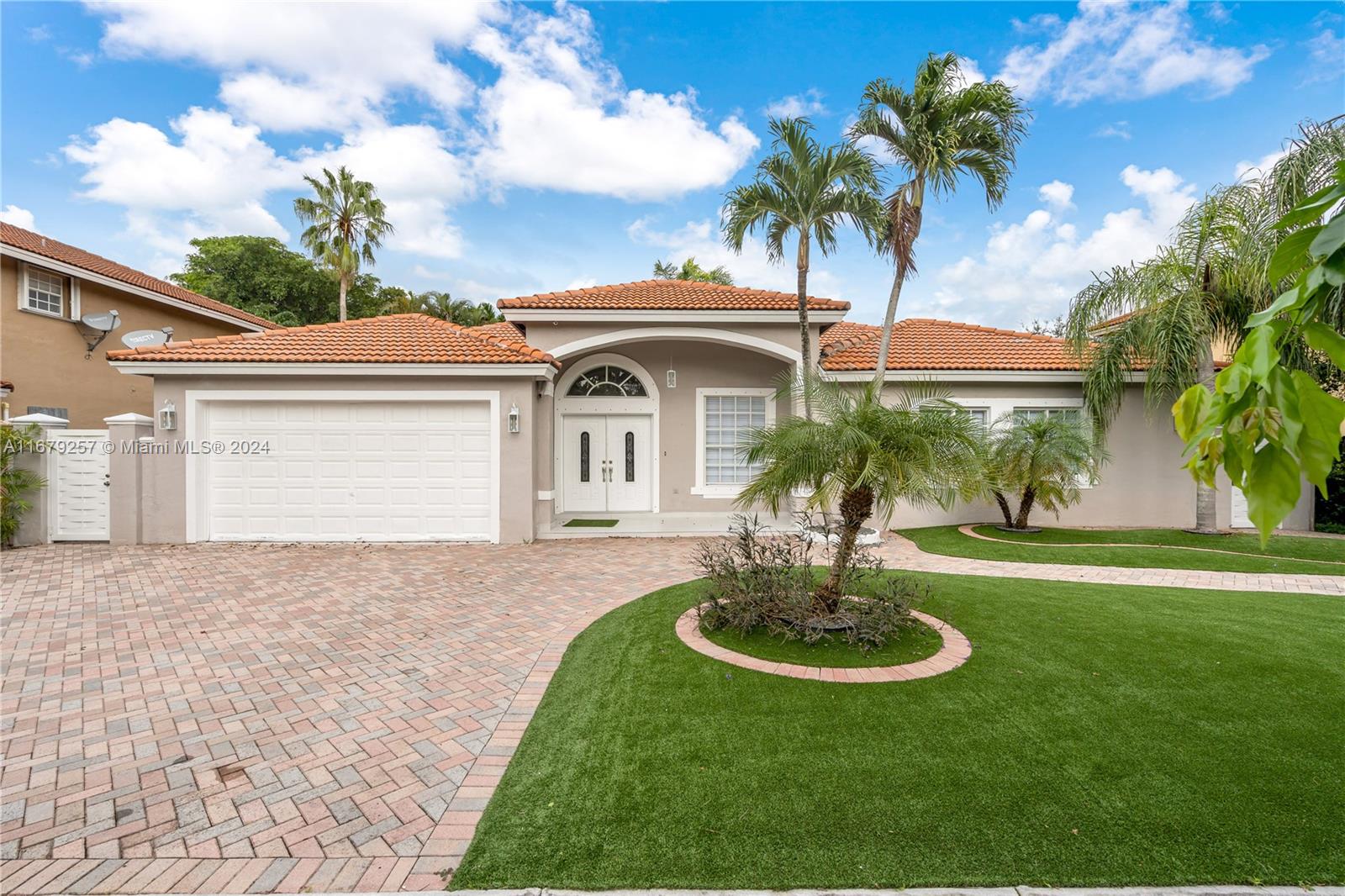 This beautifully refreshed one-story home in the desirable Garden Hills community boasts a fantastic layout with 4 beds & 3.5 baths. Featuring a Florida room and freshly painted interiors, the home showcases elegant crown molding and new flooring in the bedrooms, all equipped with spacious closets. The large kitchen includes granite countertops, wooden cabinets, and brand-new appliances installed this year. Step outside to a landscaped garden adorned with artificial grass and a pergola, creating a serene atmosphere for entertaining. Conveniently located near major retailers such as Walmart, Home Depot, Target, and Publix, as well as Baptist West Kendall, this home offers easy access to excellent schools, making it perfect for families. Available for immediate occupancy & easy to show.