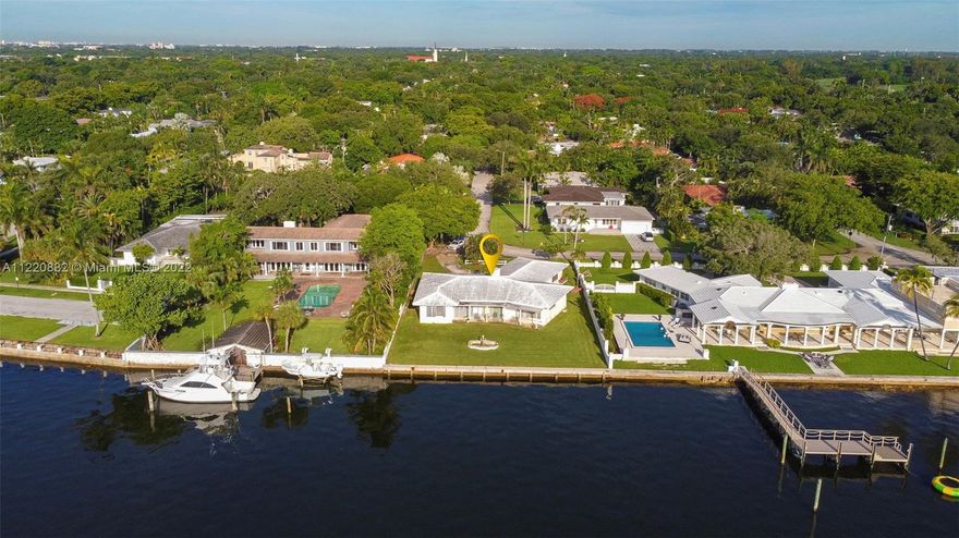 AWESOME OPPORTUNITY TO RENOVATE OR BUILD YOUR DREAM HOME.  14,000+ SQ. FT. OF LAND AND 94 FT. OF WATERFRONT ON THE OPEN BAY WITH OCEAN ACCESS.   CURRENTLY, THE HOME IS APPROXIMATELY 3,000 SQ. FT. WITH 4 BEDROOMS AND 3 FULL BATHS.  ATTACHED TWO-CAR GARAGE.