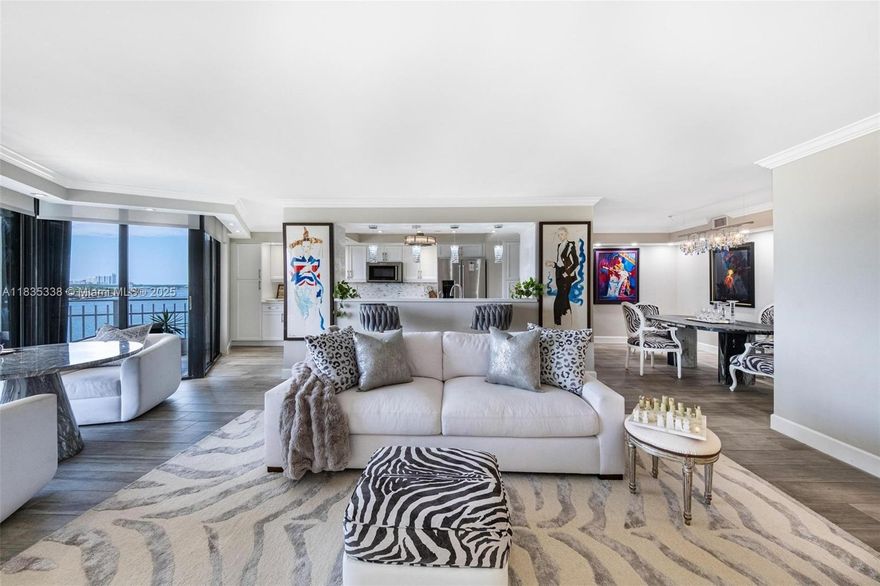 Beautiful 15th-floor renovated unit 2 Bd / 2 Ba with breathtaking views of the Intracoastal, marina & lush landscapes. Features modern finishes, crown molding, electric shades, ceramic tile floors, quartz kitchen counters, white cabinets, stainless KitchenAid appliances & floor-to-ceiling windows. Located in a 34-acre gated waterfront community with 24/7 security, 8 tennis courts, racquetball, gym, spa, 2 restaurants, pools, marina, and kids' areas. Pet-friendly. HOA includes cable, internet, water, hot water & amenities. Near beaches, parks, schools & airport. A perfect place to create lasting family memories.