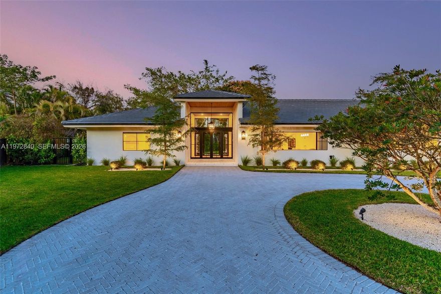 Introducing a fully custom Organic Modern estate unlike anything Palmetto Bay has seen! This stunning single-story home blends warmth and craftsmanship from the moment you arrive, featuring dramatic floor-to-ceiling stonework, herringbone foyer floors, and views of the private courtyard and fire pit upon entry. With nearly 4,000 SF under air, expansive living and dining areas with vaulted ceilings flow seamlessly into the open family room and chef’s kitchen complete with custom cabinetry, leathered quartzite countertops, a statement Lofra range, paneled Thermador appliances, and an oversized breakfast nook overlooking the pool and backyard. A versatile office/playroom, three secondary bedrooms with two beautifully finished baths, and a spacious primary suite with sitting area, dual walk-in closets, and spa-like bath complete the interior. Exquisite landscaping with curated landscape lighting elevates the home day and night, while Venetian plaster accents, designer hardware, a 5,000 SF driveway, over half an acre with plenty of yard, and a 2 car garage complete this exceptional residence, setting a new standard in Palmetto Bay. Designed by WeRemodelit Co. Near Miami's Top Rated schools and within close proximity to Deering Estate and Hiking / Biking trails.
