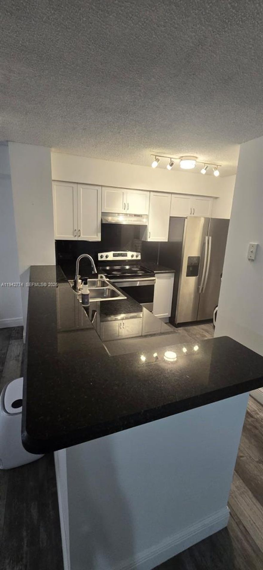 Prime location in the HEART of Hollywood, FL. Close to TARGET, PUBLIX & shopping centers along Hollywood Blvd, I-95, MEMORIAL REGIONALHOSPITAL, & POLICE/FIRE STATIONS. 15 min. away from the beach and INTERNATIONAL AIRPORT.  Includes RENOVATED kitchen & bathrooms, updated WOOD LAMINATE flooring, TANKLESSWATER HEATER, HURRICANE IMPACT WINDOWS, WASHER/ DRYER, outdoor STORAGE UNIT, ASSIGNED and GUEST PARKING. GATED COMMUNITY Amenities include ACCESSTO 2 POOLS, JACUZZI, CLUBHOUSE, DOG PARK area, GYM, & TENNIS COURTS.