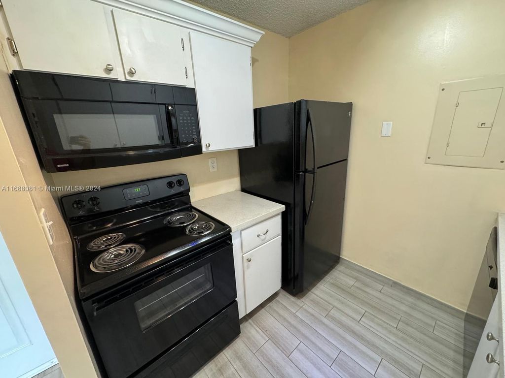 Photo of 1191 N Benoist Farms Rd #302, West Palm Beach, FL 33411 (MLS # A11688081)