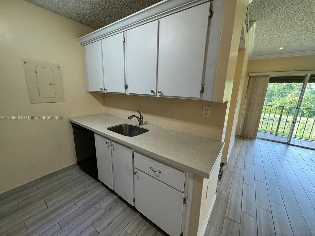 Photo of 1191 N Benoist Farms Rd #302, West Palm Beach, FL 33411 (MLS # A11688081)