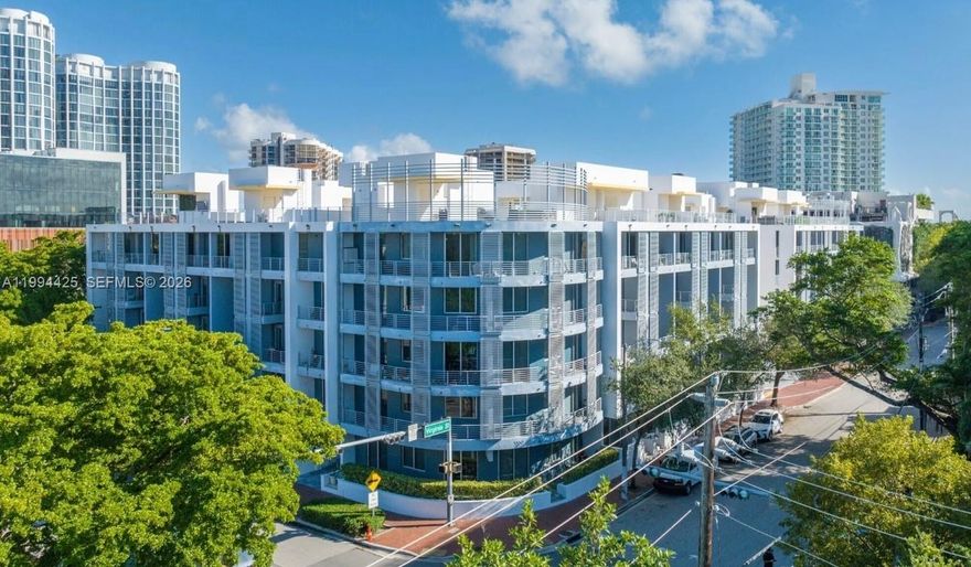 Welcome to sophisticated living in the center of Coconut Grove. This beautifully updated 1-bedroom, 1.5-bath condo offers a fresh take on urban living. The kitchen features premium appliances and sleek countertops, opening into a spacious living area with double-height ceilings. The first floor balcony is perfect for relaxing or entertaining. Upstairs, the generously sized primary bedroom features dual closets and large bathroom. This unit includes one assigned parking space and access to a range of amenities including a pool and fitness center. Just a short walk to Cocowalk, this is your opportunity to enjoy the lively lifestyle of the Grove in a move-in-ready home