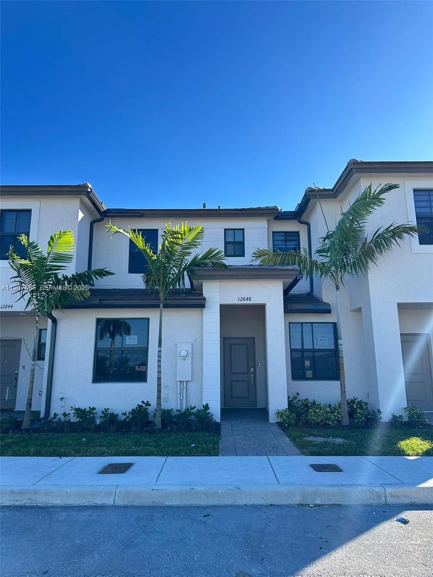 Modern 2024 townhouse in gated Siena Reserve featuring 3 bedrooms and 3 full baths, including a convenient first-floor bedroom perfect for guests or anyone who prefers no stairs. Open kitchen with stainless steel appliances, washer and dryer, and a private backyard ideal for grilling or outdoor relaxing. Enjoy clubhouse access, pool, playground, and private security in a growing community with easy access to main roads and daily essentials.