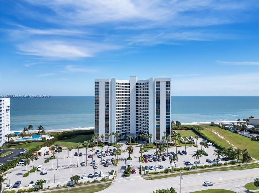 Wake up to the sound of waves and sunrise over the Atlantic in this beautifully renovated 2-bedroom, 2-bath oceanfront condo. Offering almost 1,300 square feet of thoughtfully designed living space, this residence blends comfort, style, and easy coastal living. Step inside to sweeping ocean and intercoastal views that fill the open-concept layout. The modern kitchen features quartz countertops, stainless steel appliances, and white shaker cabinetry. A custom bar with a built-in wine refrigerator adds the perfect touch for entertaining or relaxing at the end of the day. This turnkey home is fully furnished with tasteful, coastal-inspired décor, making it ideal for full-time living or a seasonal escape. Recent upgrades include LVP flooring, remote control blinds, and hurricane impact windows and doors, along with accordion shutters for added protection. Located in a private, gated beachfront community, residents enjoy resort-style amenities including a heated pool and spa, outdoor kitchen, tennis and pickleball courts, fitness center, sauna, and social spaces. Direct beach access, a secured lobby, and additional storage complete the package. Move right in and start enjoying the oceanfront lifestyle—just bring your essentials.