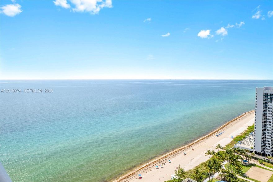 Beautiful studio plus den, 1-bath residence located on the 27th floor of Beach Club Tower II with breathtaking ocean, Intracoastal, and city views. This bright and spacious unit features elegant wood flooring throughout the living areas and marble finishes in the bathroom. Semi-renovated with stylish wallpaper details, upgraded interior doors, and refined finishes throughout. The kitchen features granite countertops and KitchenAid appliances. Floor-to-ceiling windows fill the residence with abundant natural light, while the private balcony offers the perfect setting to enjoy both sunrise and sunset views. Beach Club residents enjoy world-class resort-style amenities including multiple oceanfront pools, full beach and pool service, 24-hour concierge and valet, security, and a 50,000 sq. ft. fitness center and spa overlooking the Atlantic Ocean. Ideally located near Gulfstream Park, Aventura Mall, fine dining, and entertainment. Exceptional opportunity to own in one of Hallandale Beach’s premier oceanfront communities.