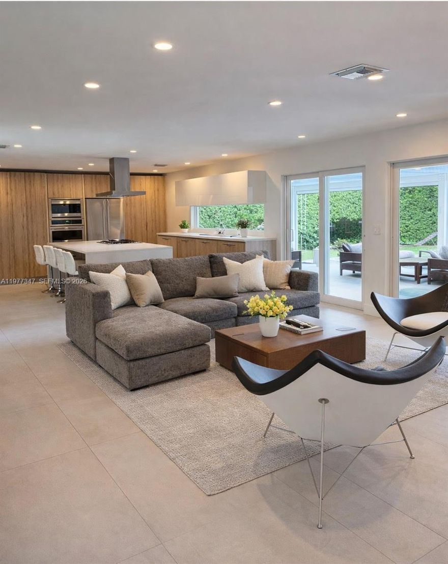 Move-in ready pool home in the highly desirable Highland Lakes neighborhood. This beautifully updated 3-bedroom, 2-bath residence offers approximately 1,900 square feet of bright open living space designed for modern family living and effortless entertaining. The home features a spacious open-concept layout, porcelain floors throughout, impact windows, and numerous upgrades that enhance both style and efficiency. The modern kitchen is the centerpiece of the home, complete with quartz countertops, custom cabinetry, a professional gas cooktop, and premium smart appliances, all overlooking the main living and dining areas. Large impact windows bring in natural light while offering views of the private backyard and pool. The primary suite provides a comfortable retreat with generous closet space and an updated bathroom. Two additional bedrooms offer flexibility for family, guests, or a home office. Step outside to a private backyard oasis featuring a renovated pool and an oversized covered terrace ideal for entertaining. The expansive terrace offers incredible potential to expand the indoor-outdoor living space or create your own custom outdoor retreat. Situated on a quiet tree-lined street in Highland Lakes, this home is conveniently located near top-rated schools, parks, shopping, dining, and major highways. A fantastic opportunity for a new family to move right in while still having the space and flexibility to make the home their own.