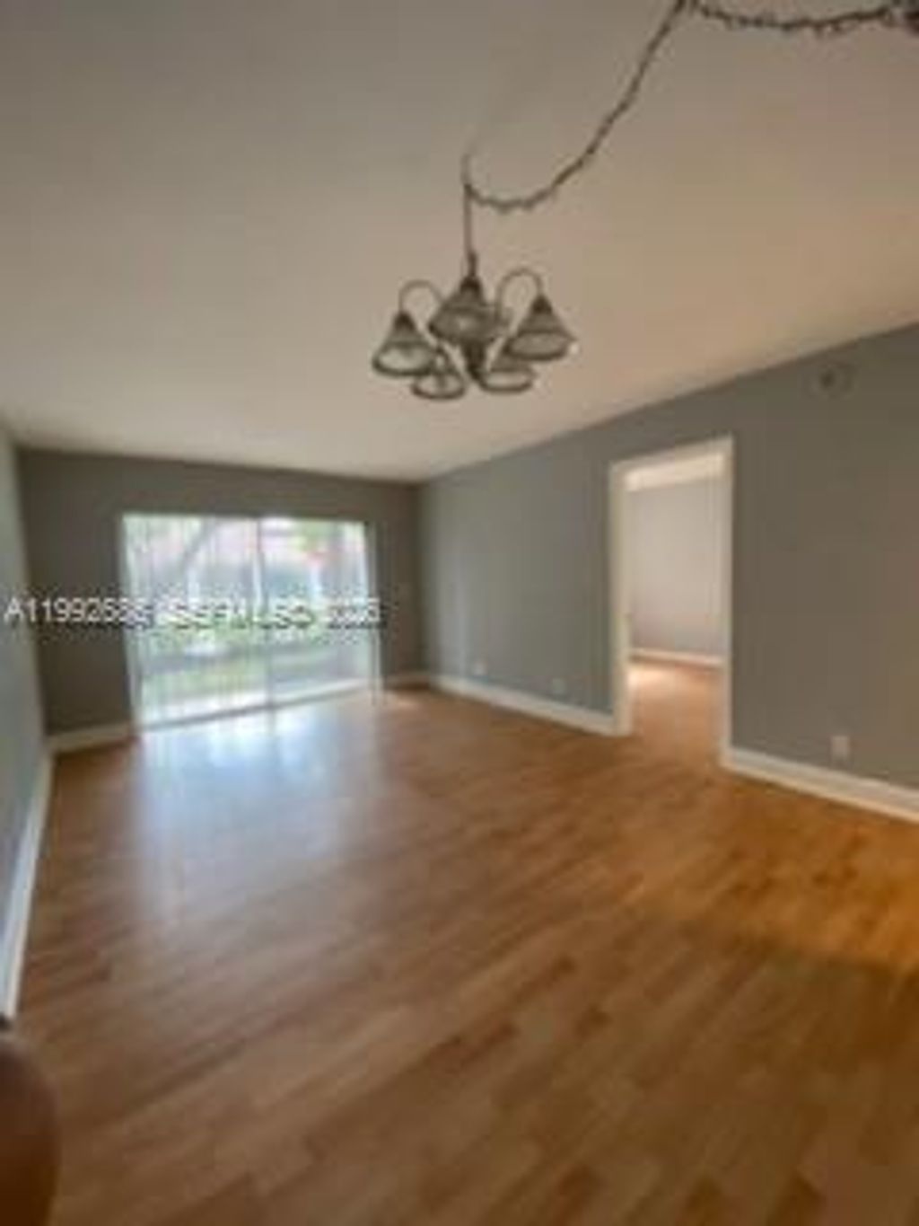 Photo of 8800 Royal Palm Blvd #102-1, Coral Springs, FL 33065 (MLS # A11992686)