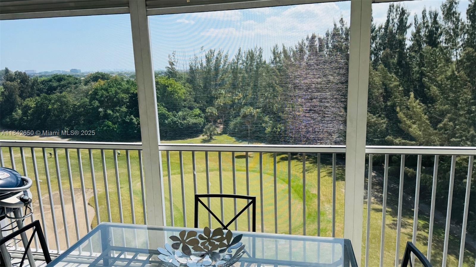 3/2 corner unit on high floor with screened-in balcony and golf course views. Largest unit in the building. Close to shopping and expressways. Foyer entrance. Kitchen features stainless steel refrigerator, stove and microwave, laminate flooring. Spacious bedrooms. Primary bedroom has 2 closets: walk-in closet and wall closet. Building has community pool, clubhouse, common laundry on floor, multiple exercise opportunities. Easy to show. Call listing agent for more information and showing instructions..