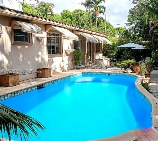 Coconut Grove. The value is in the land. Oversized lot of 10,111 sq. ft, with a large swimming pool and a 3 bed, 2 bath, 1946 home, with a 1-car garage. Note - The house will need significant updating. The property's legal description is lots 9 and 10, so possibly build two homes with City of Miami approval. The location is highly desirable South Grove, one block from Merrie Christmas Park. The postal zip code for this property is 33146. Shown by appointment only. Please DO NOT walk onto the property.