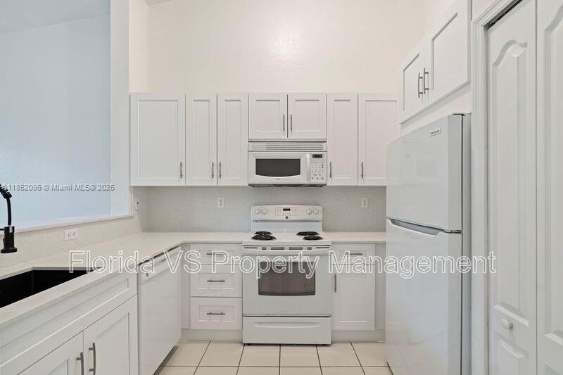 This remodeled unit features brand-new kitchen and bathrooms cabinets, offering a fresh and modern living space. The 2-bedroom condo, located on the 2nd floor, showcases a newly renovated kitchen with sleek modern cabinets and elegant quartz countertops. Nestled within a secure gated community with 24/7 security, residents can enjoy peace of mind. The condo provides combine dining and living areas, accentuated by high ceilings, tile flooring, and the warmth of carpeted bedrooms. The convenience of an in-unit washer and dryer cannot be overstated. Moreover, the master bedroom is enhanced by a walk-in closet, which complements the generous storage options throughout the unit. Welcome section 8 applicants