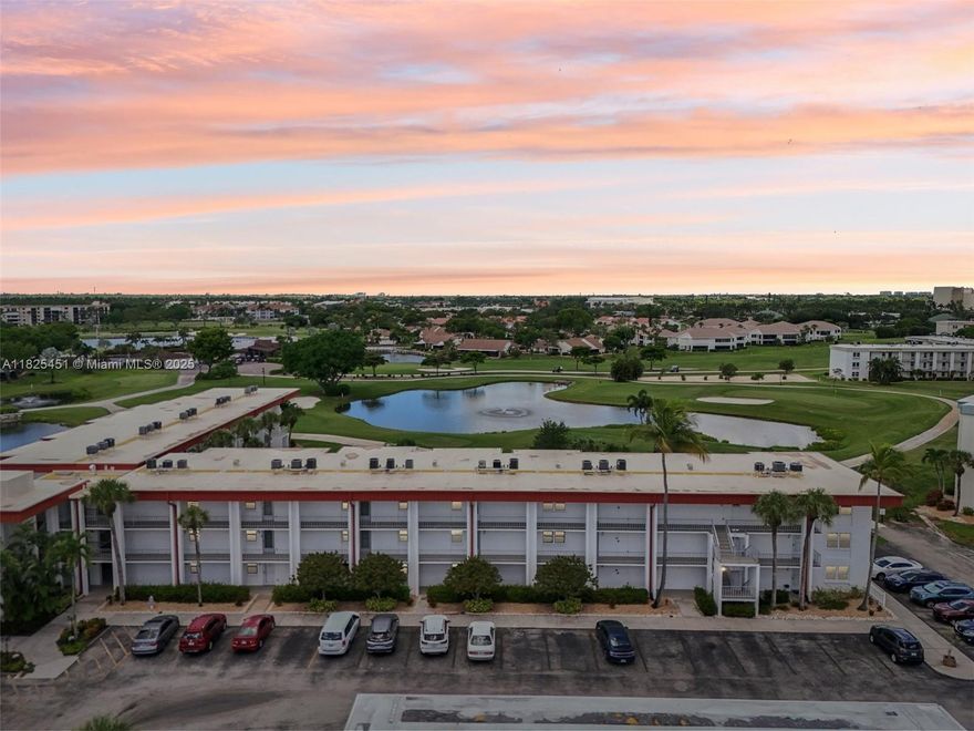 This updated, fully furnished 2nd-floor unit overlooks the 2nd tee box and features a spacious SW-facing lanai with water views and roll-down sunshades. Enjoy peace of mind with impact windows and your own golf cart included. Located in a vibrant bundled golf community with endless amenities: 6 pools, pickleball, bocce, basketball, a fitness center, woodshop, art room, library, and more. Dine at the Tee Room, play a round on the executive course, or relax poolside—two pools are just steps away. The building offers an elevator, laundry, BBQ area, bike racks, golf cart barn, assigned covered parking, and two storage areas. Gated with 24/7 security and centrally located near shopping and dining. Plus, enjoy planned excursions and themed dinners every month.
