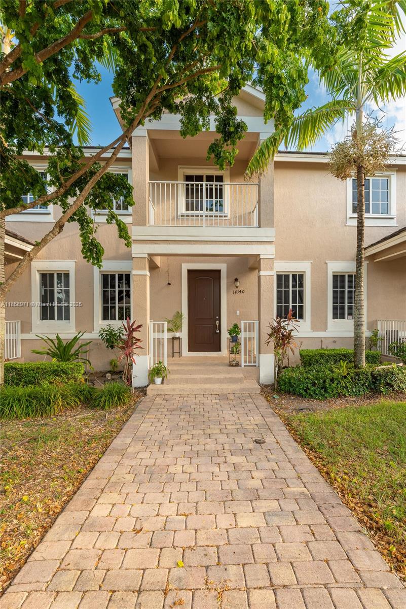 RESORT-STYLE TOWNHOME - RARE 5-CAR PARKING. In a premier community featuring a grand entrance with oversized door and covered front patio. Stainless steel appliances, granite countertops, and tile flooring in first floor & all wet areas. Private rear lanai extends living space outdoors, while the oversized paver driveway + garage accommodate private parking for up to 5 vehicles. Quick walk to resort-style amenities, including one of Homestead’s largest pools, a state-of-the-art fitness center, and a modern clubhouse. HOA covers 24/7 security, high-speed internet, cable TV, lawn care, and access to all amenities, offering exceptional value. Minutes to the Florida Turnpike, shopping, and dining, this home blends style and convenience and is ready for your immediate enjoyment.