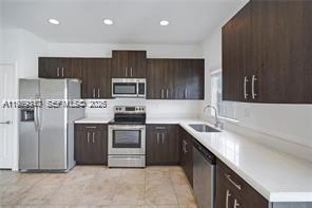 Photo of 1121 NW 41st Ln, Lauderhill, FL 33313 (MLS # A11979317)