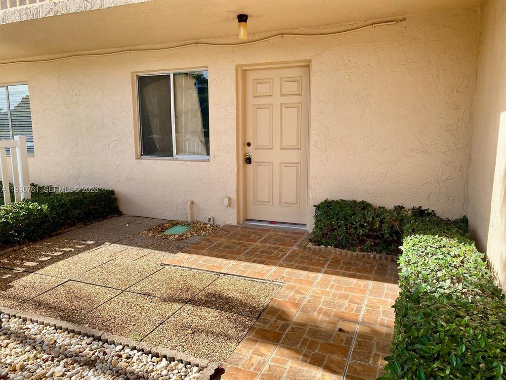 Photo of 6935 Huntington Ln #108, Delray Beach, FL 33446 (MLS # A11990761)