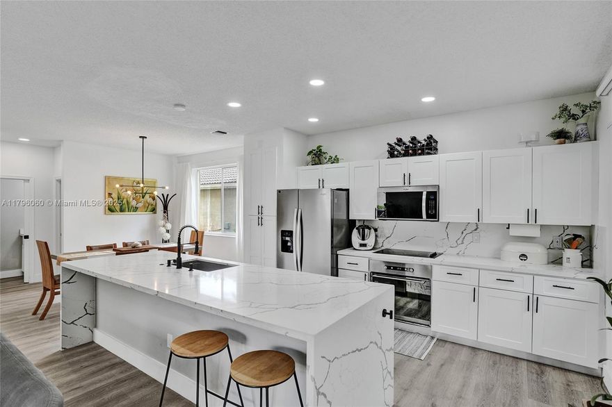 Beautiful home in Savanna, one of Weston's most desirable communities, with access to excellent schools. This 4-bedroom, 2.5-bathroom property stands out for its recently remodeled bathrooms with modern, high-quality finishes, as well as the kitchen, which is ready to be enjoyed. All bedrooms have full closets, offering functional and well-distributed spaces. It features a hurricane-proof garage door and epoxy flooring. Its large yard with trees invites you to enjoy family time, organize outdoor gatherings, or simply relax in a natural setting. Its roof and A/C motor are only 2 years old! This immaculately maintained property combines contemporary design and comfort. Located in the resort-like community, residents enjoy a wealth of amenities. Schedule your visit and enjoy the tour.