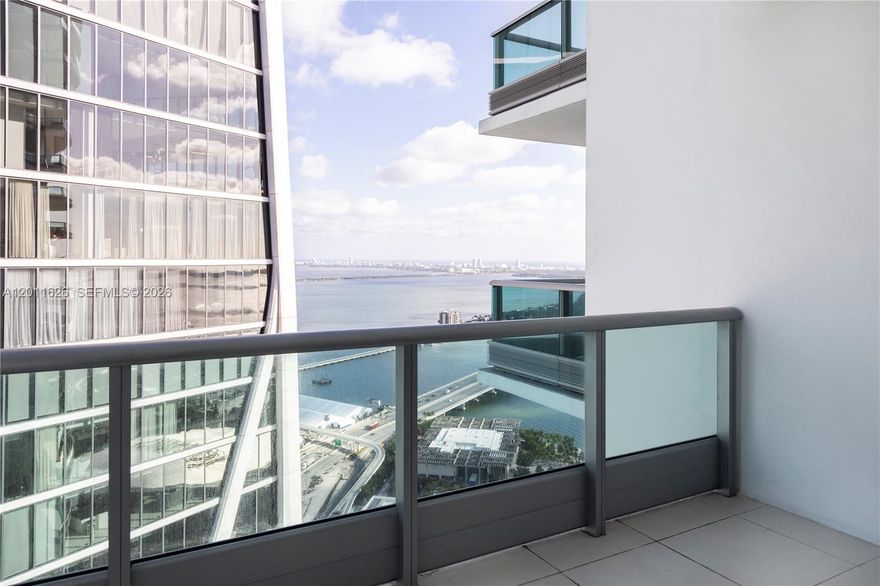 TENANT OCCUPIED UNTIL 5/31/27.
Residence 5510 at 900 Biscayne is a beautifully reconfigured 1-bedroom plus den, now a spacious 2-bedroom, 2-bathroom residence, positioned on the 55th floor with sweeping panoramic views of Biscayne Bay and Miami’s skyline. Floor-to-ceiling windows and high ceilings flood the space with natural light, while white glass tile flooring adds a clean, modern finish throughout.

The open kitchen is equipped with premium Sub-Zero and Miele appliances, complemented by high-end cabinetry and sleek finishes. The primary suite offers a custom walk-in closet, a spa-style bathroom, and direct access to one of two oversized balconies, enhancing the indoor-outdoor living experience.

900 Biscayne delivers a full-service lifestyle with resort-style amenities including two pools, a state-of-the-art fitness center, spa with steam, sauna and jacuzzi, private movie theater, club room, children’s playroom, concierge, and 24-hour valet. Cable and high-speed internet are included in maintenance. Ideally located across from Bayfront Park and Pérez Art Museum, this residence combines elevated design, premier amenities, and an exceptional waterfront location.