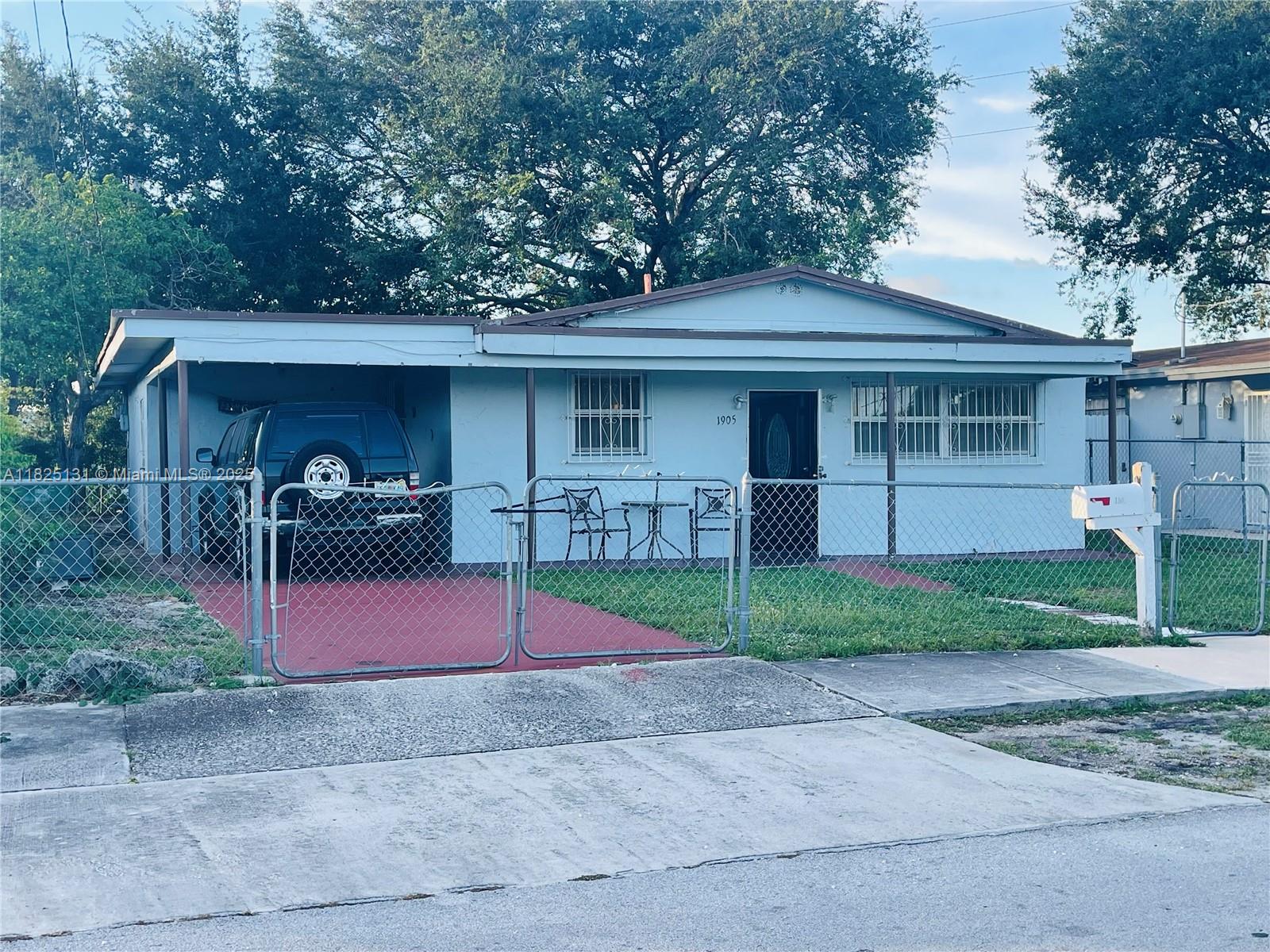 Single family home with NO HOA in rapidly growing MIAMI GARDENS. This is 3 bedroom 2 bath property perfect for a homeowner or investors. Features tile flooring throughout. Gated front yard and backyard looking out to canal. One car port with 2 additional parking spots inside property. Located just 25 MINUTES FROM MIAMI INTERNATIONAL AIRPORT and 15 MINUTES FROM HARD ROCK STADIUM, with easy access to shops, restaurants, and major highways. SCHEDULE YOUR SHOWING TODAY. THIS OPPORTUNITY WON'T LAST!