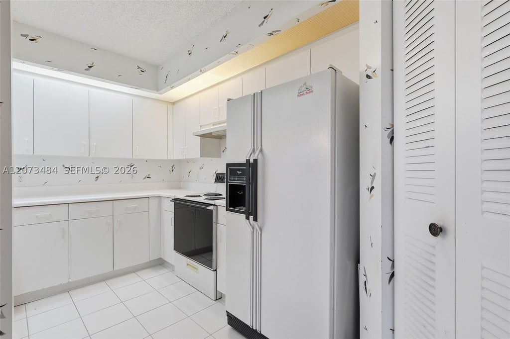 Photo of 13701 SW 12th St #311A, Pembroke Pines, FL 33027 (MLS # A12073484)