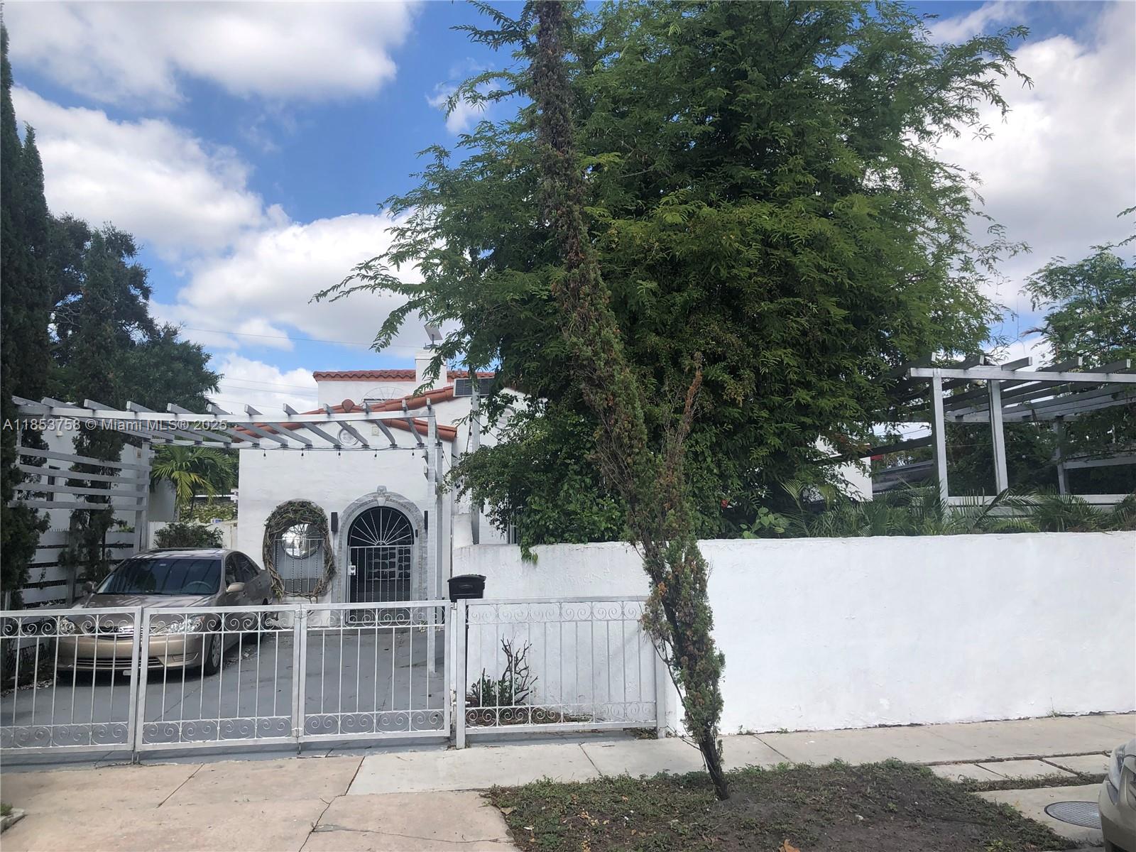 This beautiful home in the historic Shenandoah neighborhood blends Spanish Colonial charm with contemporary style. It features 3 spacious bedrooms, 3 renovated bathrooms, and an additional room that can be converted into a private suite or AirB\&B. The property boasts original touches such as Dade pine wood floors and a wood-burning fireplace, along with a modern kitchen with black granite countertops. The garden includes fruit trees and a private entrance. Located in a revitalized area of Miami, it is close to Miami Beach, the city's cultural center, and just 15-20 minutes from Miami International Airport.