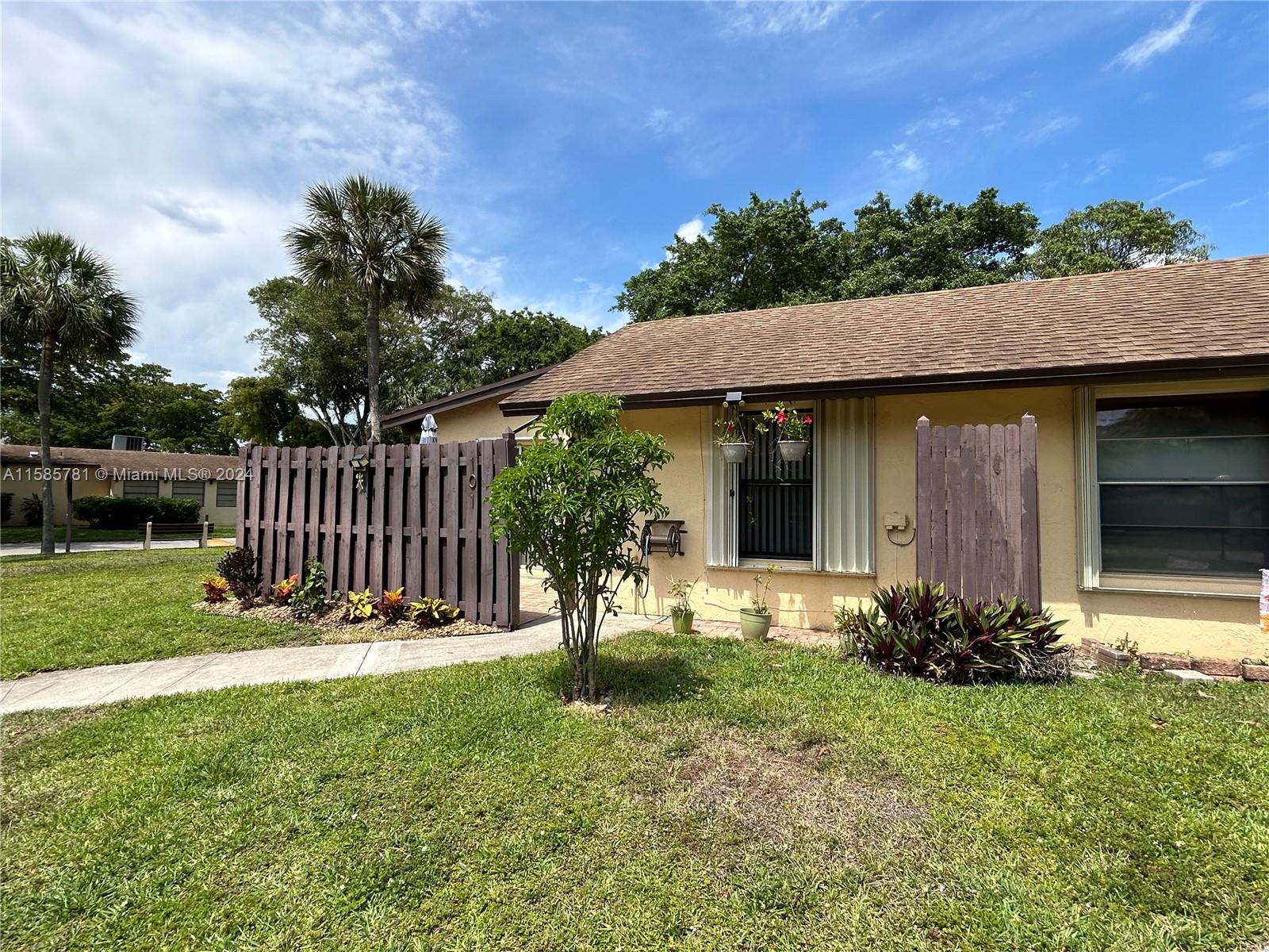 PRICED TO SELL ::: BEAUTIFULLY UPDATED MODEL VILLA IN A VERY DESIRABLE GATED COMMUNITY. A 2/2 HOUSE ON A LARGER CORNER LOT. THIS HOUSE WAS REDONE TO PERFECTION AND BEAUTY. SPECIAL TOUCHES MAKES THIS UNIT UNIQUE. FEATURES INCLUDE: BRAND NEW APPLIANCES; QUARTS COUNTERS; VINYL FLOORS; NEW WINDOWS; HURRICANE SHUTTERS; BRAND NEW WINDOW BLINDS, CEILING FANS, LIGHTING AND MORE. MUST SEE IT YOURSELF TO APPRECIATE THIS IMMACULATE, BRIGHT AND SPACIOUS HOME. CENTRALLY LOCATED JUST 3 MINUTES FROM HARD ROCK CASINOS, RESTAURANTS, SHOPPING AND MAJOR HIGHWAYS. PLEASE DONT MISS OUT! THIS WON'T LAST!