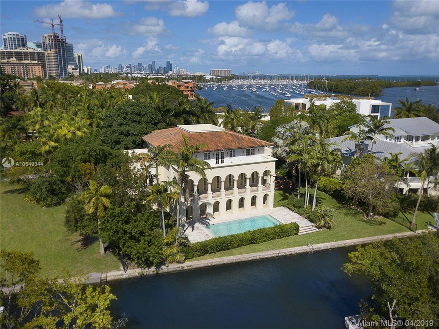 Ideally situated in the heart of the Grove behind gates of exclusive Camp Biscayne, this 2003 built home boasts 122’ of water frontage & breathtaking views of the Bay, canal & natural landscape.  The elegant style offers sophistication w/ details like mahogany trimmed impact glass drs & wndws, Brazilian wd & Jerusalem marble flrs, arches & vaulted ceilings. Formal spaces incl gracious dining rm & huge liv rm that flows out to a balcony spanning the back of the home. Cook’s kitchen offers gas, high end appliances & breakfast rm overlooking the canal. Outside are many covered balconies & open porches, including a roof top terrace & heated, saline pool w/ keystone flrs & views of the boat basin at La Brisa. 1st floor ac’d bonus space w/ full bath, 2 car gar, organic mosquito repellant system.