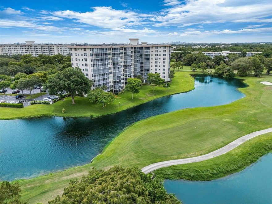 This stunning 10th-floor penthouse offers breathtaking wraparound views of the golf course and lakes. The balcony, enclosed with impact glass, seamlessly extends into the living area, creating a vast entertaining space of 1840 SQ FT under air conditioning. Updated kitchen. Laundry room with pantry storage area. Maintenance includes water, Hotwire cable and internet. Walking distance to heated community pool, BBQ facilities. Location is minutes from I-95, Harrah's casino, shops, restaurants, and airport.  Turnkey and ready for you to move in!