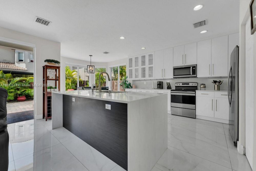 Property for Sale at 10738 Nw 70th Ln, Doral, Miami-Dade County, Florida - Bedrooms: 5 
Bathrooms: 3  - $1,224,000