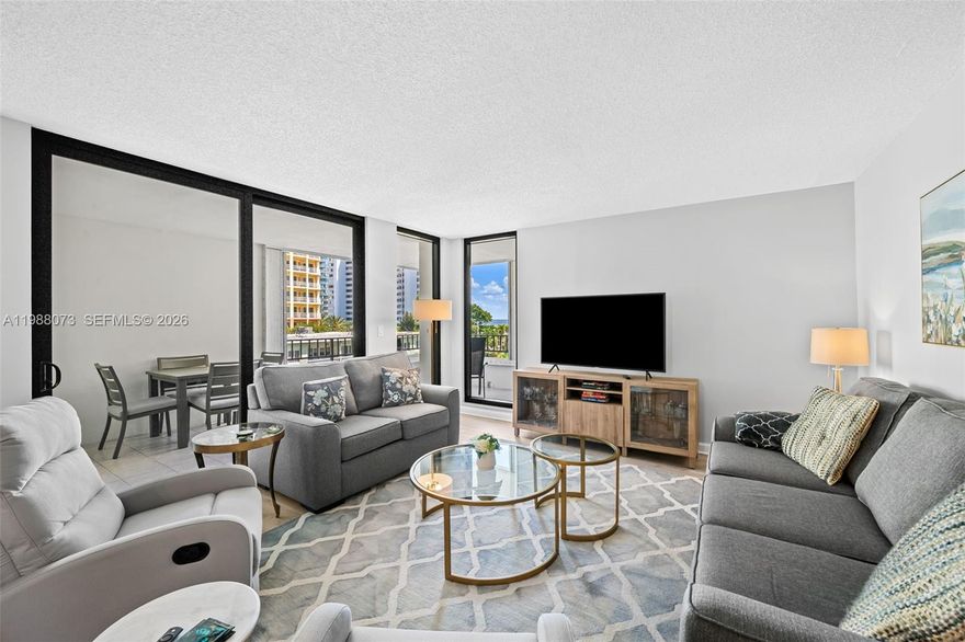 EASY TO SHOW! Enjoy the best of South Florida beach living at Emerald Tower, a well-maintained condo offering intercostal access and PRIVATE BEACH ACCESS to El Mar Beach Club directly across the street! The building has completed all milestone inspections and has been renovated throughout. With Northeast exposure, you can bask in the morning sun and enjoy incredible views of the ocean and intercostal from your wraparound balcony. This large 2 bedroom/2bathroom PLUS EXTRA ROOM (currently used as a 3rd bedroom) features full impact windows and doors (2019), newer high-end engineered European laminate flooring, updated bathrooms, water heater (2024), and brand new water filtration system. The modern kitchen has plenty of of storage, spacious living and dining room area, oversized closets, washer/dryer hook-up, 1 covered parking spot, and additional storage on the same floor! The primary suite has the perfect nook for a home-office! The building has a heated pool, gym, billiards room, recreational room for large gatherings and events, and plenty more!