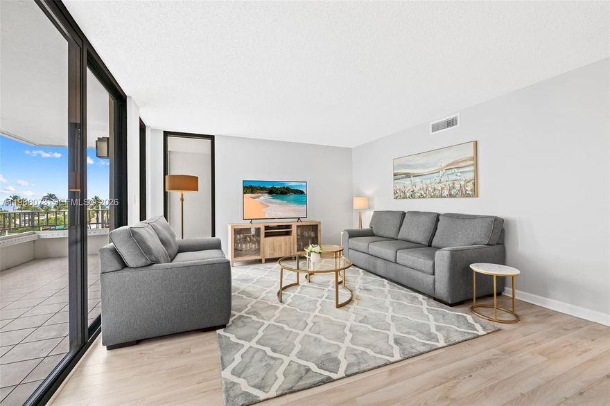 EASY TO SHOW! Enjoy the best of South Florida beach living at Emerald Tower, a well-maintained condo offering intercostal access and PRIVATE BEACH ACCESS to El Mar Beach Club directly across the street! The building has completed all milestone inspections and has been renovated throughout. With Northeast exposure, you can bask in the morning sun and enjoy incredible views of the ocean and intercostal from your wraparound balcony. This large 2 bedroom/2bathroom PLUS EXTRA ROOM (currently used as a 3rd bedroom) features full impact windows and doors (2019), newer high-end engineered European laminate flooring, updated bathrooms, water heater (2024), and brand new water filtration system. The modern kitchen has plenty of of storage, spacious living and dining room area, oversized closets, washer/dryer hook-up, 1 covered parking spot, and additional storage on the same floor! The primary suite has the perfect nook for a home-office! The building has a heated pool, gym, billiards room, recreational room for large gatherings and events, and plenty more!