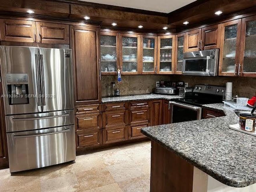 Gorgeous condo which has been totally upgraded of 1 bedroom and 1.5 bathrooms. Travertine floors throughout and granite countertops. Stainless steel appliances and custom made cabinetry. Club house has workout room, billiards and tv area. There are 3 pools in this community.